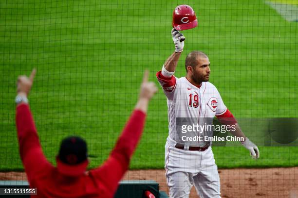 Joey Votto of the Cincinnati Reds celebrates his 300th career home run in the third inning during their game against the Chicago Cubs at Great...