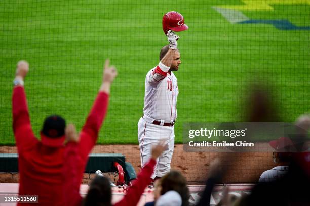 Joey Votto of the Cincinnati Reds celebrates his 300th career home run in the third inning during their game against the Chicago Cubs at Great...