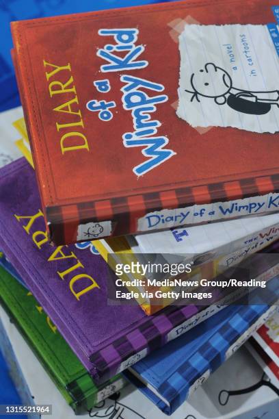 Exeter Township, PA&#10;&#10;A detail photo of a stack of "Diary of a Wimpy Kid" books owned by Connor McHugh of Exeter Township.&#10;&#10;Photo by...