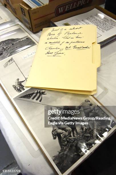 The flag raising at Iwo Jima was one of the most noticeable photos for sale.&#10;&#10; Manuscripts, photos an other items from the estate of military...