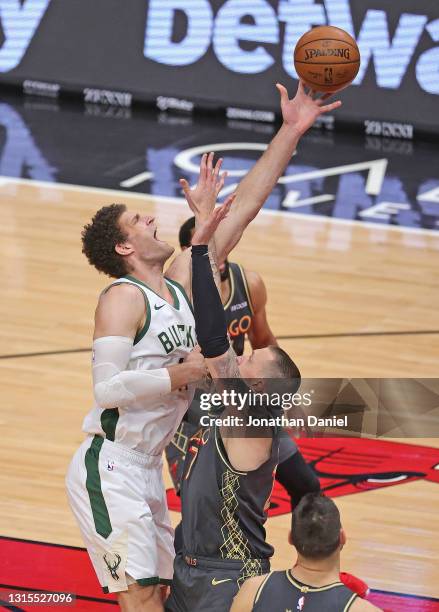 Brook Lopez of the Milwaukee Bucks shoots over Daniel Theis of the Chicago Bulls at the United Center on April 30, 2021 in Chicago, Illinois. NOTE TO...