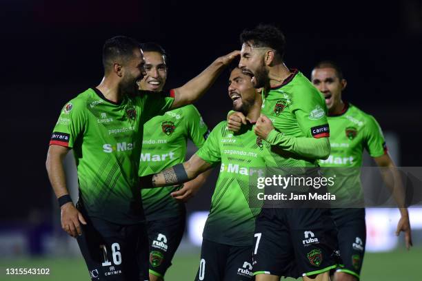 Martin Galvan of Juarez celebrates with teammates after scoring his team's first goal during the 17th round match between FC Juarez and Toluca as...