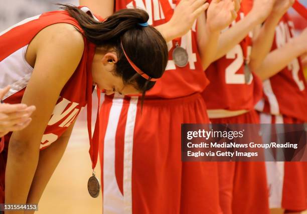 Wilson's Talitha Poore hangs her head and cries after receiving the Bulldogs' second place medals.GIRLS BASKETBALL Wilson Bulldogs vs. Red Lion Lady...