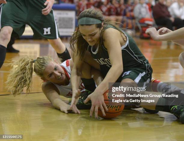 Methacton's Jackie Cerchio pulls in a loose ball in front of Wilson's Carley Brew .GIRLS BASKETBALL Wilson Bulldogs defeat the Methacton Warriors in...