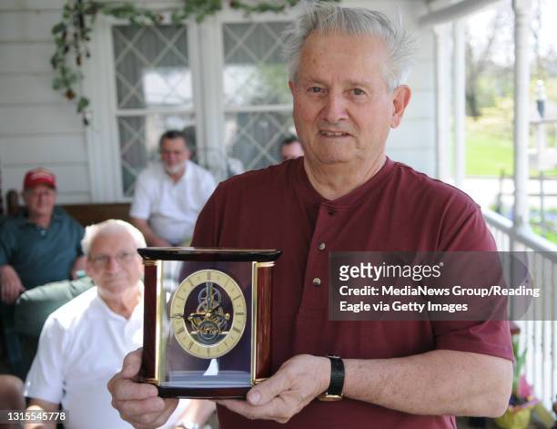 Photo by Tim Leedy 4/7/10Gene Appolloni of Temple with a clock presented to him for running a golf tourney of former ATT plant employees. The golf...