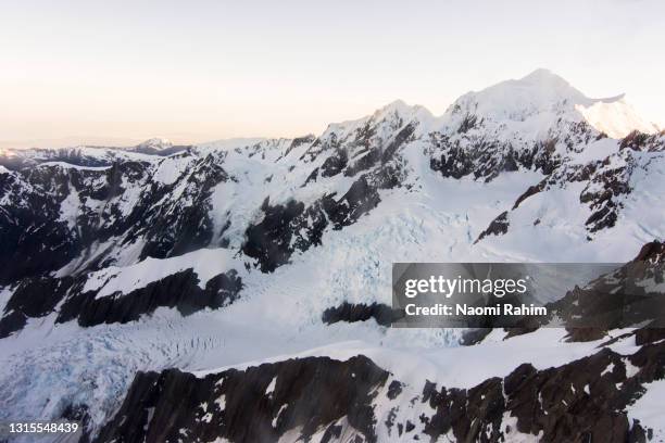 majestic aerial view of sunrise over franz josef glacier, new zealand - franz josef glacier stock-fotos und bilder