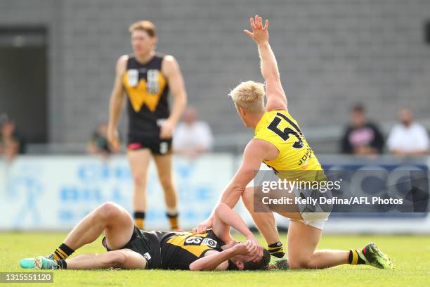 Steven Morris of the Tigers calls for assistance for Keegan Gray of Werribee during the round three VFL match between Werribee and Richmond Tigers at...
