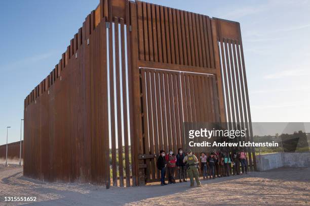 United States Border Patrol agents detain families from Central and South America who have been crossing into the United States from Mexico to ask...