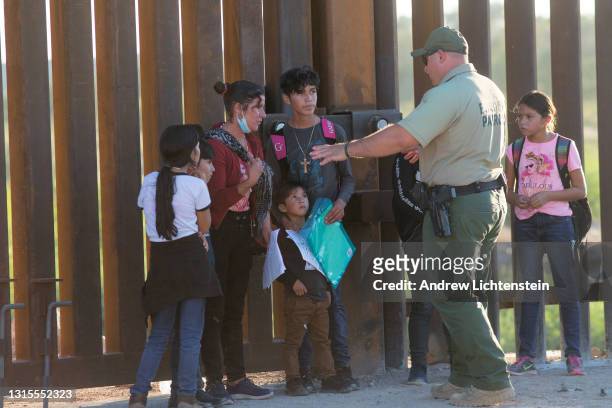 United States Border Patrol agents detain families from Central and South America who have been crossing into the United States from Mexico to ask...