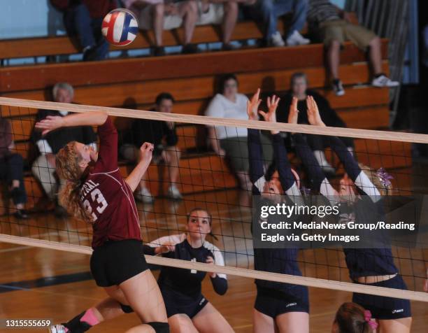 Reading, PACentral Catholic's Sarah Simpson tries to spike the ball past Holy Name's Tori Hutchinson , Rachael Burke , and Mary Bosshard .Scholastic...