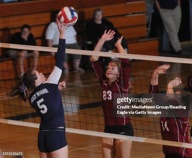 Reading, PAHoly Name's Rachael Burke tries to put a shot past Central Catholic's (Sarah Simpson and Jessica Antos .Scholastic Girls Volleyball the...