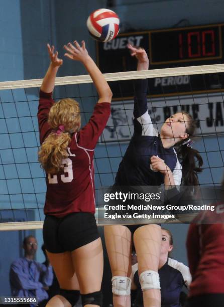 Reading, PAHoly Name's Rachael Burke tries to hit the ball past Central Catholic's Sarah Simpson .Scholastic Girls Volleyball the Central Catholic...