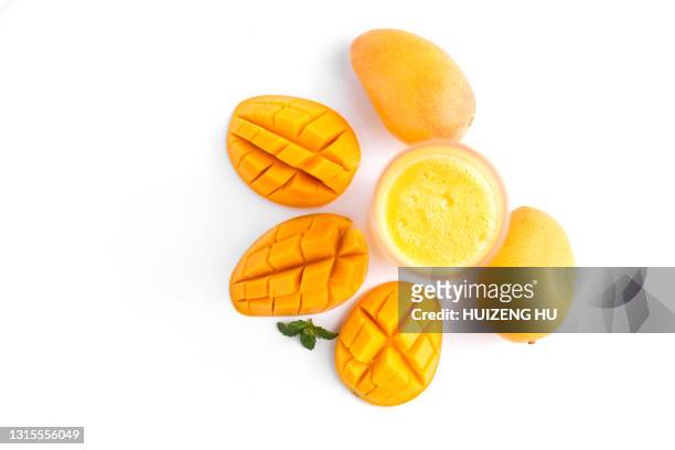 fresh mango smoothie in the glass. top view. glass of mango juice. - mango smoothie stock pictures, royalty-free photos & images