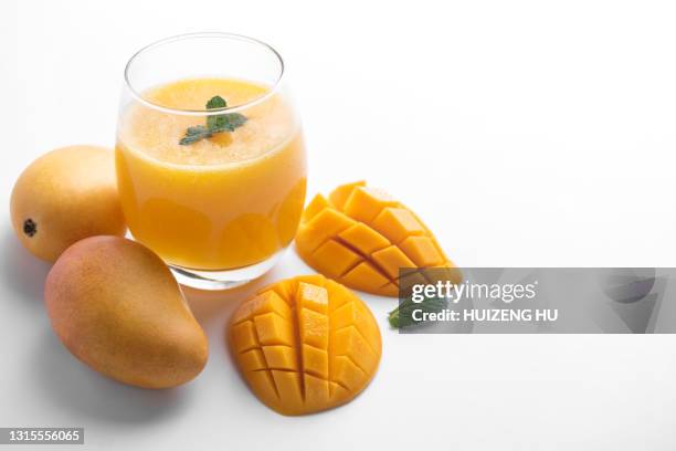 fresh tropical fruit smoothie mango juice. glass of mango juice. - mango smoothie stock pictures, royalty-free photos & images