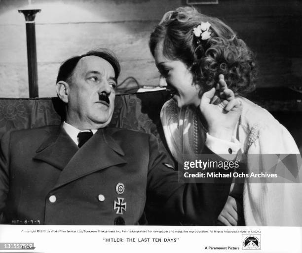 Alec Guinness relaxing with his mistress Doris Kunstmann in a scene from the film 'Hitler: The Last Ten Days', 1973.