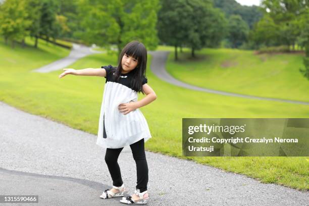 mixed race little girl  strike a pose - child high heels stock pictures, royalty-free photos & images