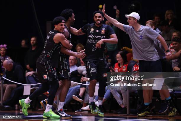 Tai Webster, Levi Randolph and Corey Webster of the Breakers celebrate their victory during the round 16 NBL match between the New Zealand Breakers...