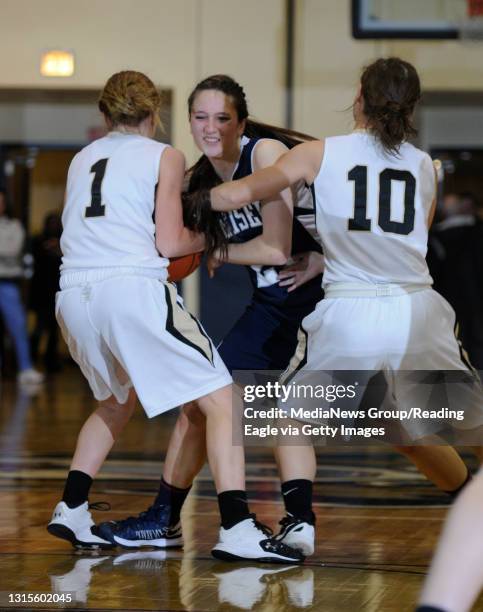 Berks Catholic's Katrina Balatgek and Berks Catholic's Molly Janiszewski converge to steal the ball from Conrad Weiser's Aarika Ferko .GIRLS...