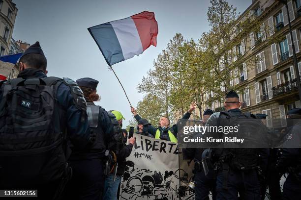 Gilets Jaunes, or yellow vest, protestors demonstrate on May Day against President Macron's economic reforms, the insufficient state of the French...