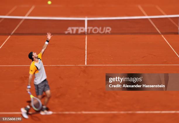 Jan-Lennard Struff of Germany serves during his quater final match against Filip Krajinovic of Serbia on day 7 of the BMW Open at MTTC IPHITOS on...