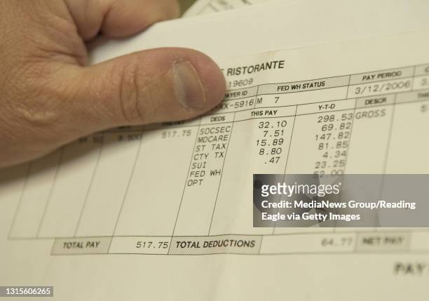 Photo by Tim Leedy 5/3/06A pay stub from an illegal immigrant shows that social security was deducted from the pay but the individual is not a...