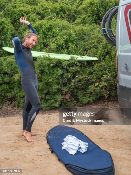 male surfer comes back at his van - dry van stock pictures, royalty-free photos & images