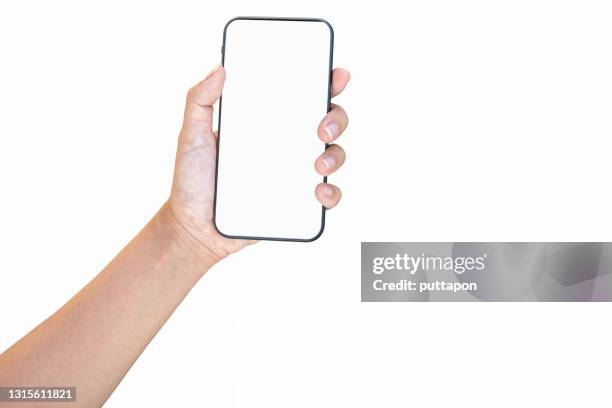 close up of woman hand holding smartphone on white background, cropped hand using smartphone on the background white - vasthouden stockfoto's en -beelden