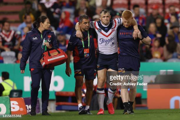Brett Morris of the Roosters comes off injured during the round eight NRL match between the Newcastle Knights and the Sydney Roosters at McDonald...