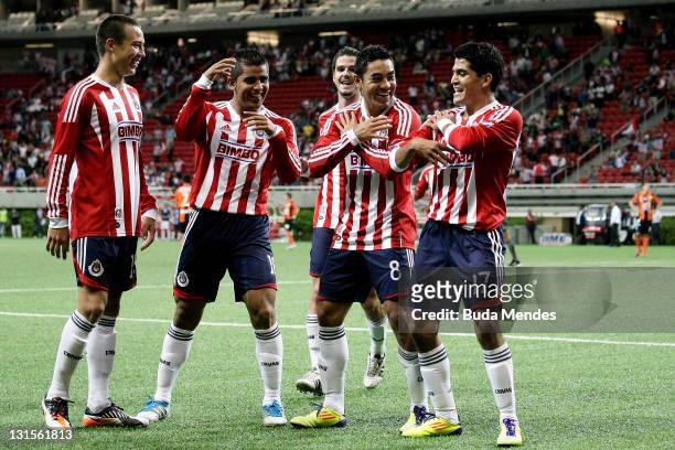 Players of Chivas celebrate a scored goal againist Pachuca during a match as part of Apertura 2011 at Omnilife stadium on November 05, 2011 in...