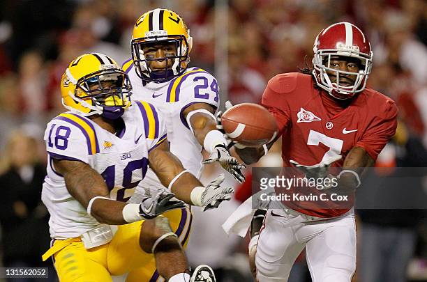 Kenny Bell of the Alabama Crimson Tide fails to pull in his touchdown attempt against Brandon Taylor and Tharold Simon of the LSU Tigers at...