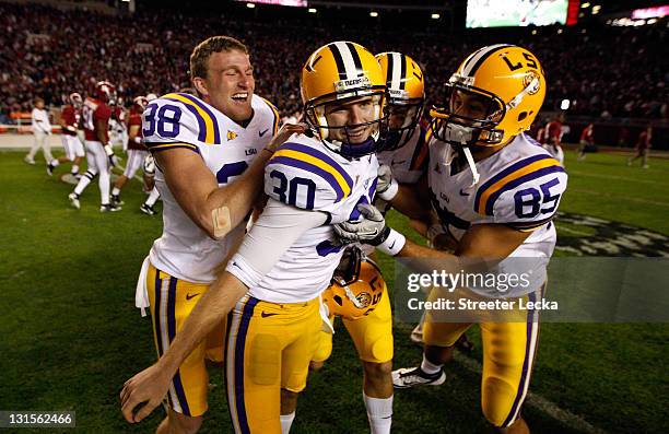 Drew Alleman of the LSU Tigers celebrates after kicking the game-winning field goal in overtime to defeat the Alabama Crimson Tide 9-6 during their...