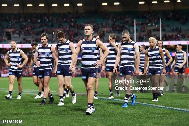 Joel Selwood of the Cats and team mates look dejected after losing the round seven AFL match between the Sydney Swans and the Geelong Cats at Sydney...
