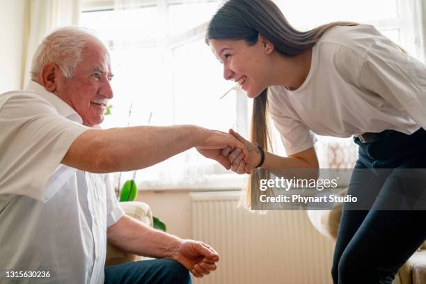 kissing grandfather’s hand, celebration islamic event - kissing hand stock pictures, royalty-free photos & images