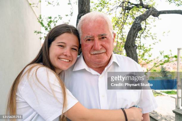 young girl taking pictures with grandparents - co op city stock pictures, royalty-free photos & images