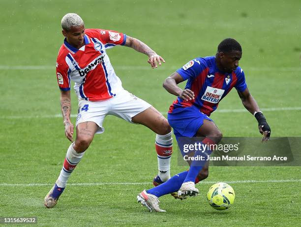 Deyverson of Deportivo Alaves and Papakouli Diop of SD Eibar battle for the ball during the La Liga Santander match between SD Eibar and Deportivo...
