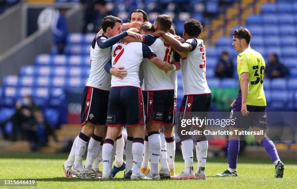 Gethin Jones of Bolton Wanderers celebrates with team mates Jordan Williams, Kieran Lee, Antoni Sarcevic and Oladapo Afolayan after scoring his...