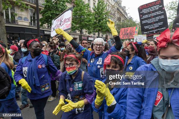 Feminist activists attend the International Labour Day protests on May 1, 2021 in Paris, France. Every year May Day is used to mark the fight for...