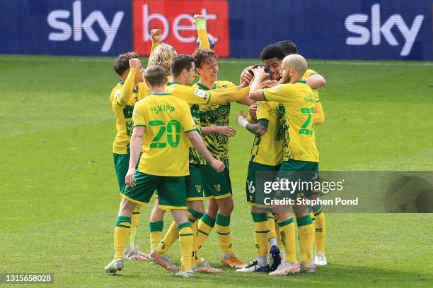 Xavier Quintilla of Norwich City celebrates with team mates after scoring their side's third goal during the Sky Bet Championship match between...