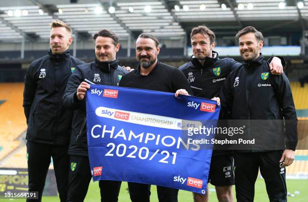 Daniel Farke, Manager of Norwich City celebrates with his backroom staff after winning the Sky Bet Championship after the Sky Bet Championship match...