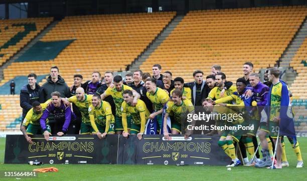 Players of Norwich City celebrate winning the Sky Bet Championship after the Sky Bet Championship match between Norwich City and Reading at Carrow...