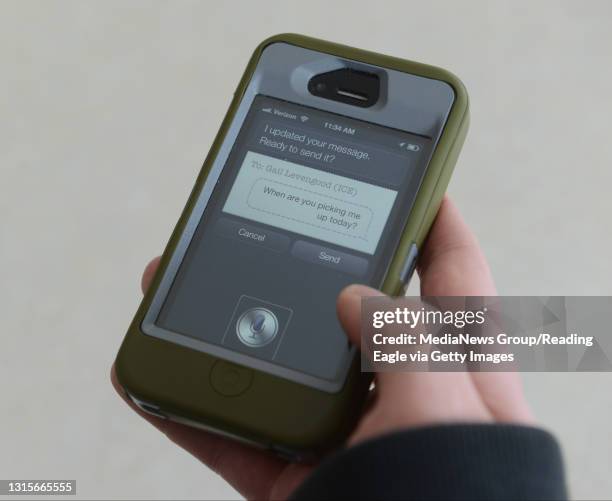 Photo Ryan McFadden Mark Levengood of Douglass twp is blind and uses his iphone to help him with tasks; here he is texting using siri on his iphone