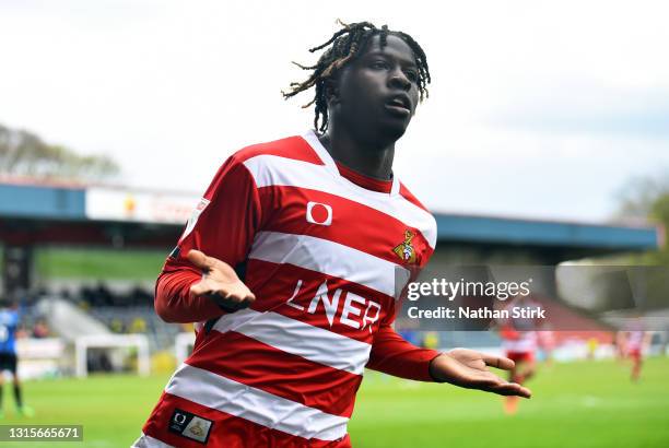 Taylor Richards of Doncaster Rovers celebrates as he scores their second goal during the Sky Bet League One match between Rochdale and Doncaster...