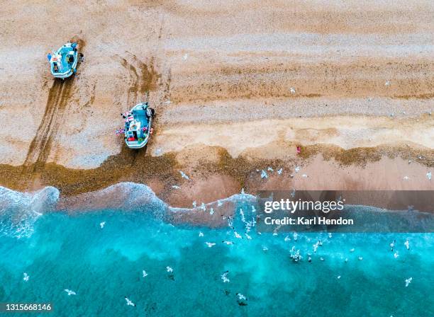 an aerial view of fishing boats at hastings beach - stock photo - fishing village stock pictures, royalty-free photos & images