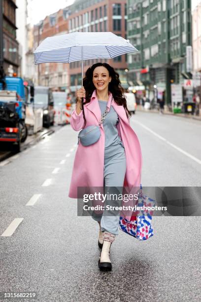 German singer Jasmin Wagner wearing a pastel pink coat by Harris Wharf London, a light blue shirt by Nili Lotan, light blue sweatpants by Nili Lotan,...