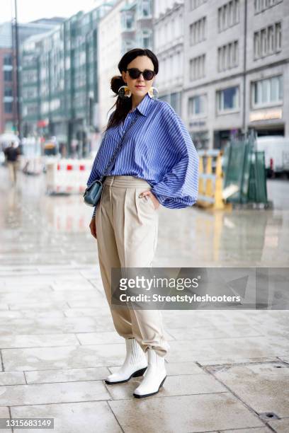 German singer Jasmin Wagner wearing a blue and white striped blouse Antonia by SoSUE, beige pants by LeGer by Lena Gercke, white boots by LeGer by...