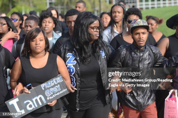 From left participating in the march are Shakeera Wynne Kiara Richardson and Steven Robinson, 23. At the Kutztown University Campus Thursday...