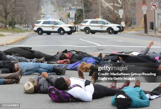 Kutztown University students from the Black Student Union stage a Die-In at Normal Ave. And College Blvd. 12/4/14 photo by Tim Leedy