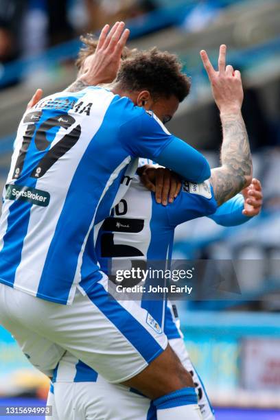 Danny Ward of Huddersfield Town shows the number 25 with his fingers in memory of his friend Jordan Sinnott as he celebrates scoring an equalising...