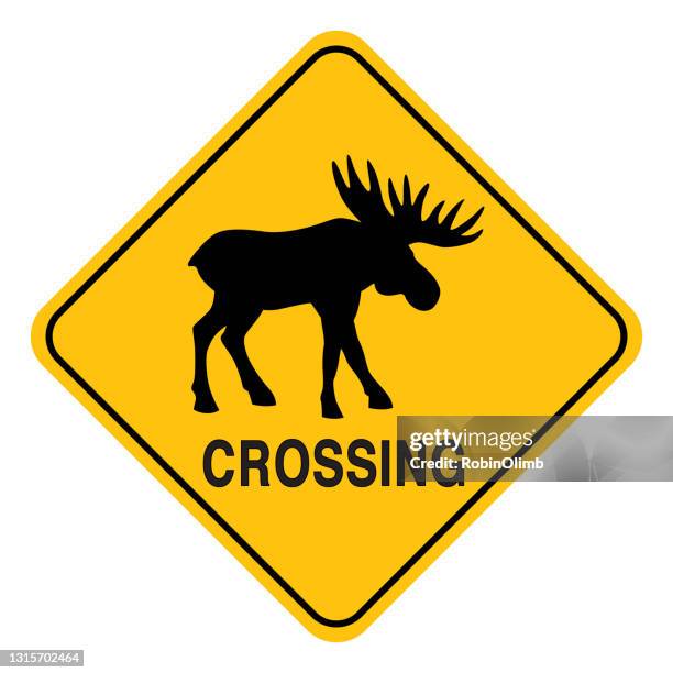moose crossing sign - moose-silhouette stock illustrations