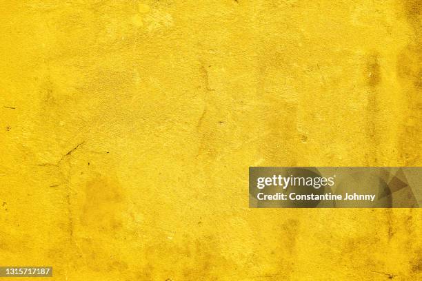 bright yellow concrete wall background - yellow wall stock pictures, royalty-free photos & images